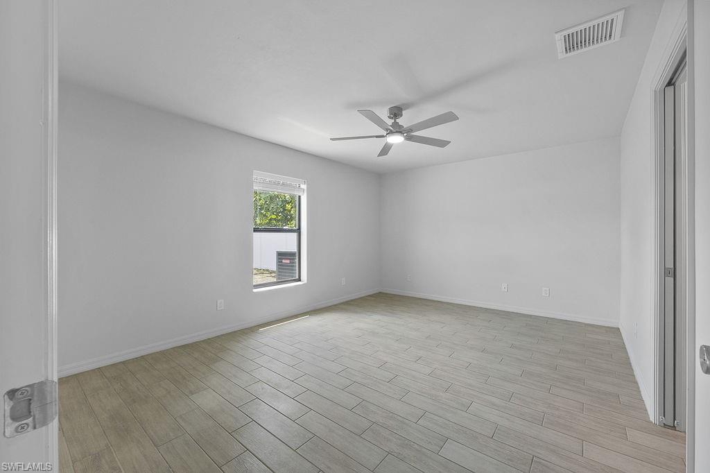 3429 Southwest 8th Place Cape Coral, FL 33914 - Photo 13 of 19 a view of an empty room with a window