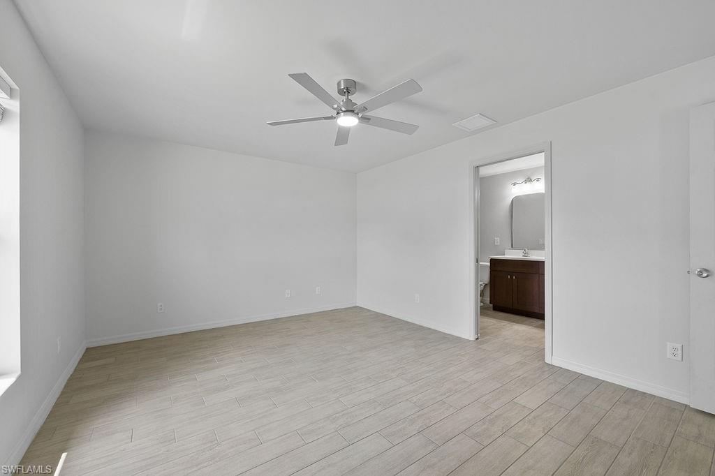 3429 Southwest 8th Place Cape Coral, FL 33914 - Photo 14 of 19 wooden floor in an empty room