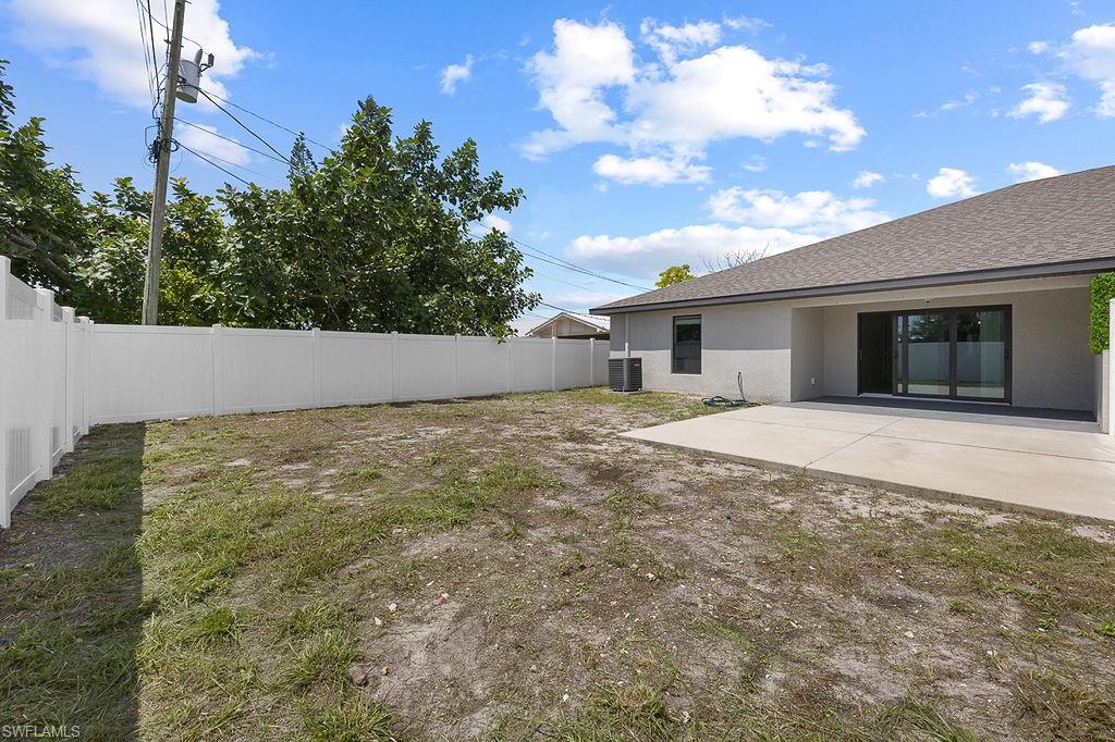 3429 Southwest 8th Place Cape Coral, FL 33914 - Photo 18 of 19 a view of house with backyard and garden