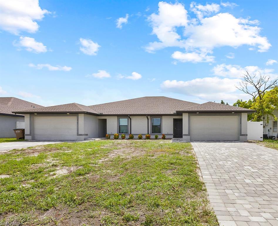 3429 Southwest 8th Place Cape Coral, FL 33914 - Photo 19 of 19 a front view of a house with yard