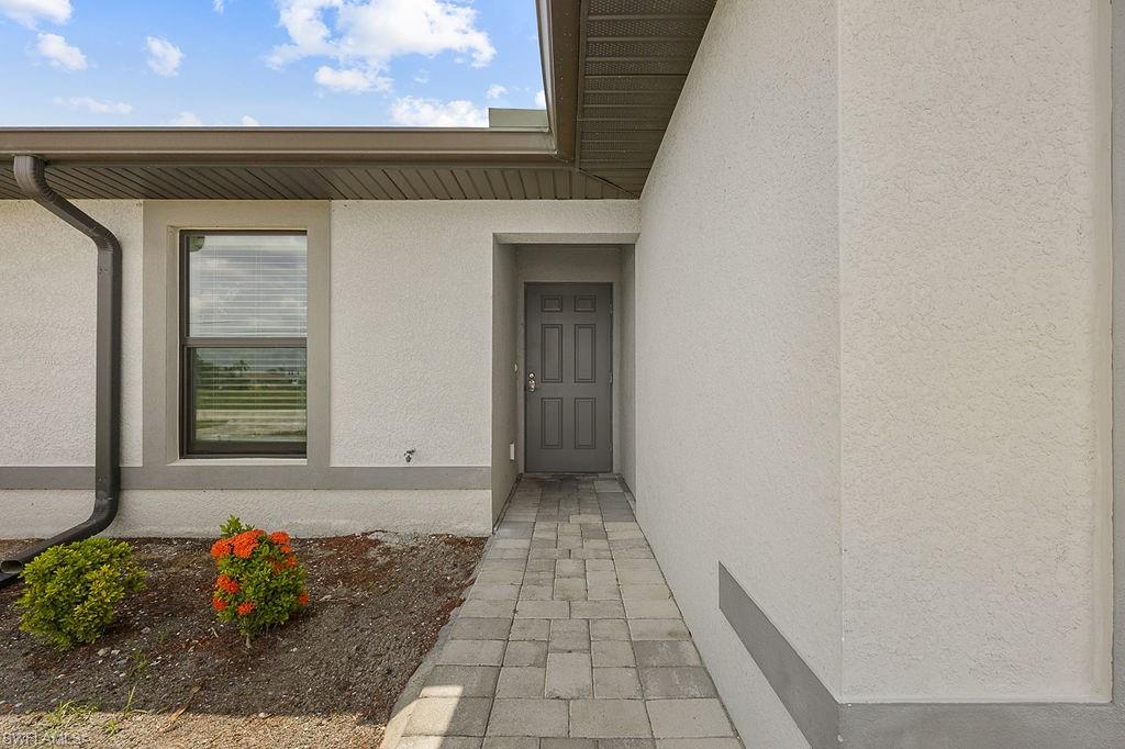3429 Southwest 8th Place Cape Coral, FL 33914 - Photo 2 of 19 a front view of a house