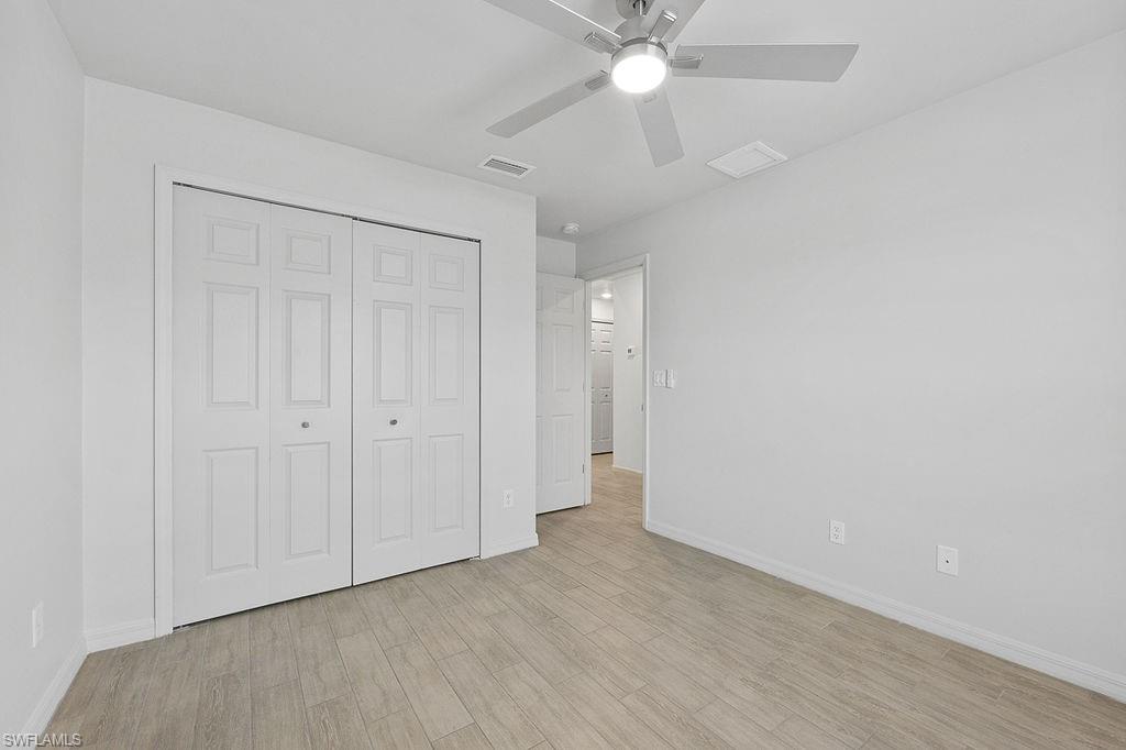 3429 Southwest 8th Place Cape Coral, FL 33914 - Photo 5 of 19 wooden floor in an empty room
