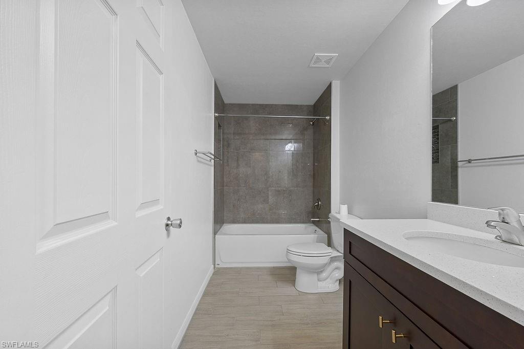 3429 Southwest 8th Place Cape Coral, FL 33914 - Photo 9 of 19 a bathroom with a sink a toilet and shower