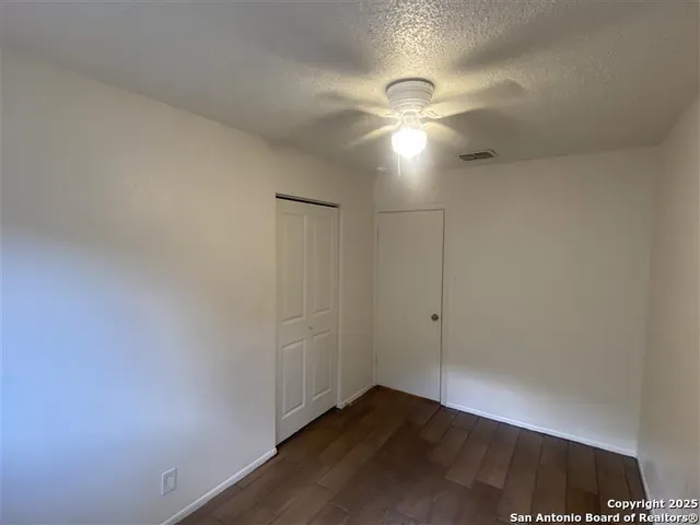 an empty room with a empty space and a window