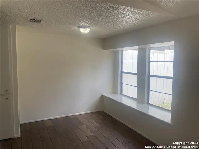 a kitchen with a sink and a refrigerator