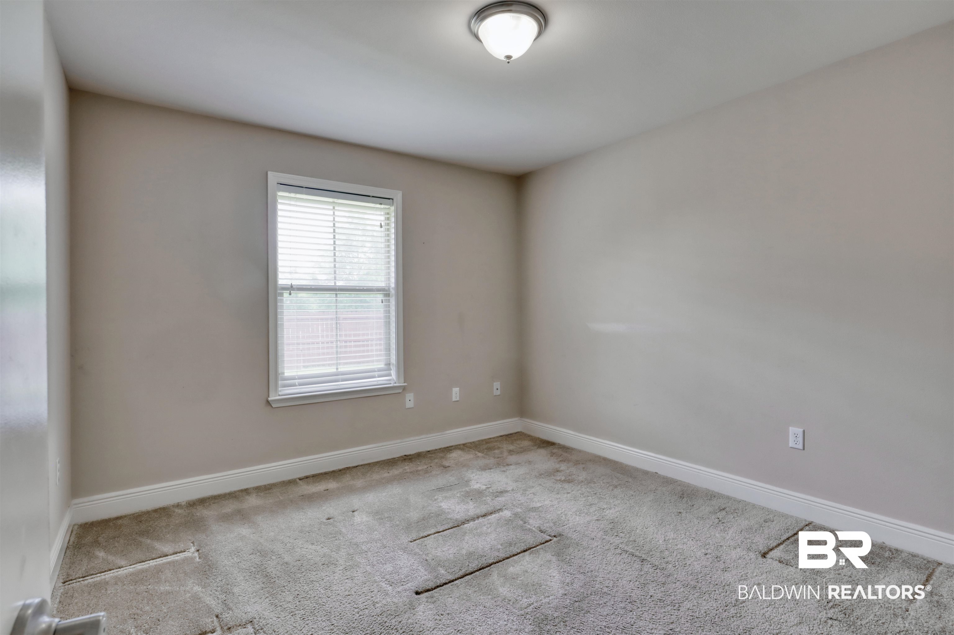 14794 Troon Drive Foley, AL 36535 - Photo 23 of 33 Carpeted empty room with baseboards