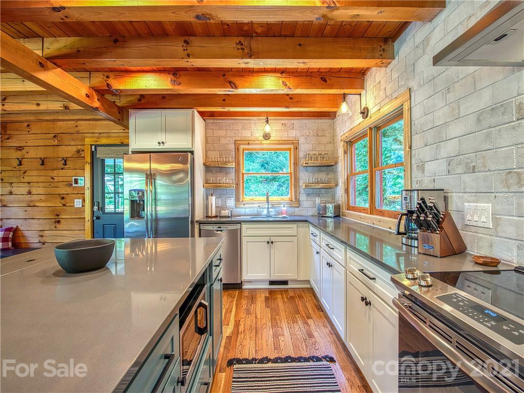 1933 Laurel Ridge North Maggie Valley, NC 28751 - Photo 13 of 44 a kitchen with counter top space and windows