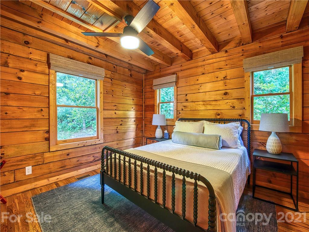 1933 Laurel Ridge North Maggie Valley, NC 28751 - Photo 22 of 44 a bedroom with a bed and a window
