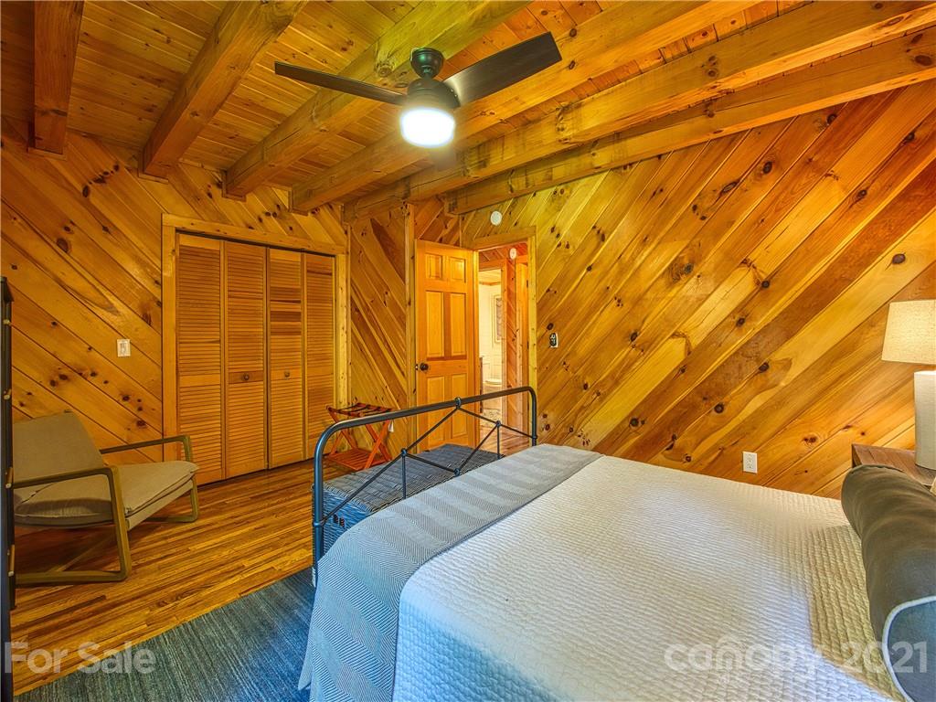 1933 Laurel Ridge North Maggie Valley, NC 28751 - Photo 26 of 44 a bedroom with a bed