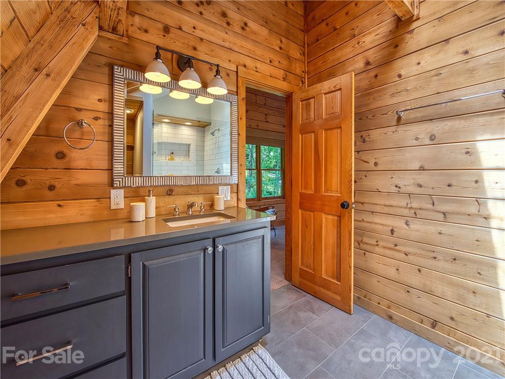 1933 Laurel Ridge North Maggie Valley, NC 28751 - Photo 30 of 44 a bathroom with a sink and a mirror