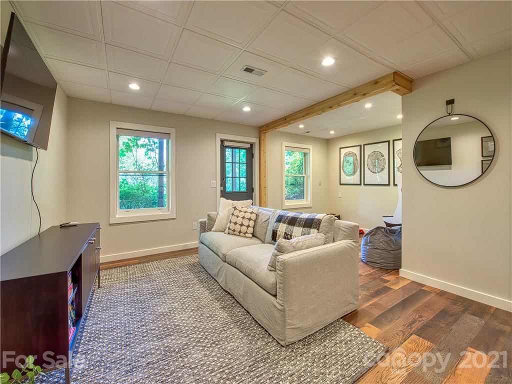 1933 Laurel Ridge North Maggie Valley, NC 28751 - Photo 31 of 44 a living room with furniture and a flat screen tv