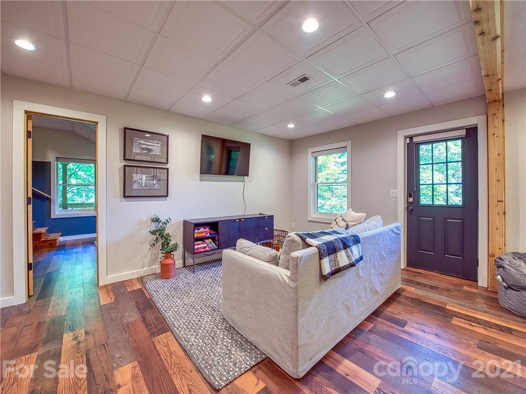 1933 Laurel Ridge North Maggie Valley, NC 28751 - Photo 32 of 44 a living room with furniture and a flat screen tv