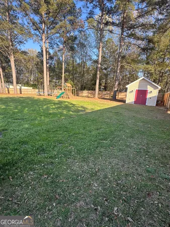 a view of a park with large trees