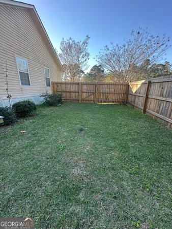 a view of backyard with green space