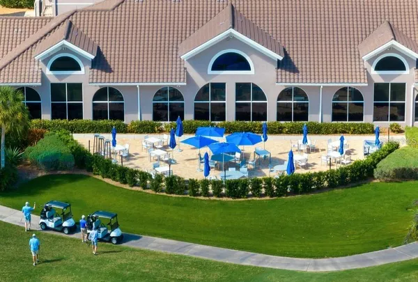 a swimming pool with outdoor seating and yard