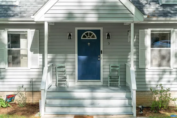 a front view of a house with glass windows