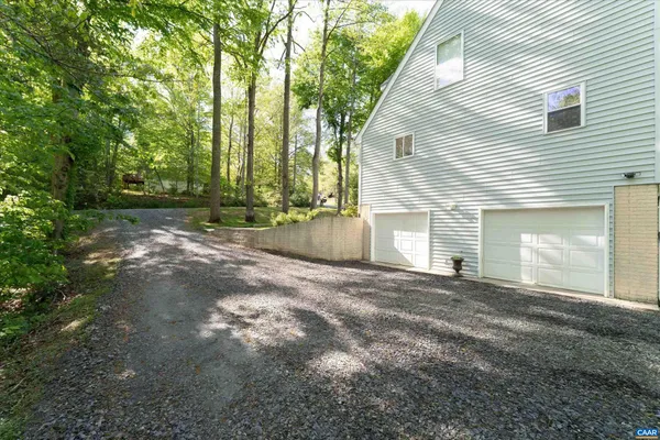 a kitchen with stainless steel appliances granite countertop a stove a sink a refrigerator and a refrigerator