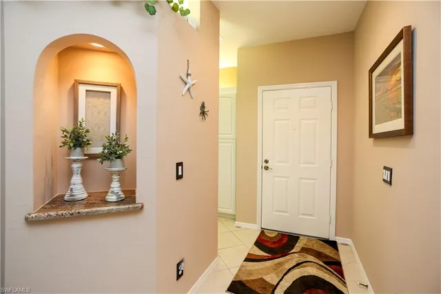 a view of a livingroom with furniture and front door