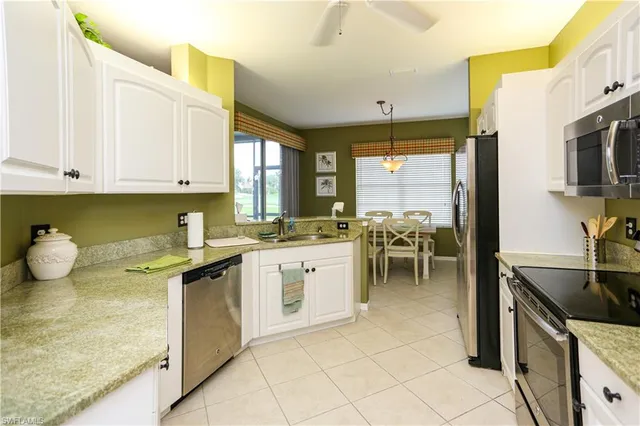 a kitchen with a sink and a stove top oven