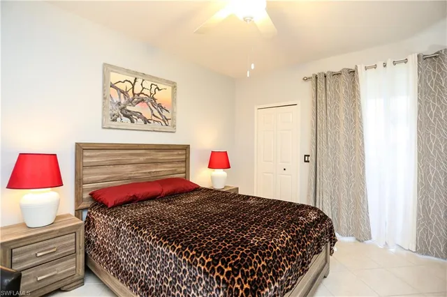 a bedroom with a bed and a closet