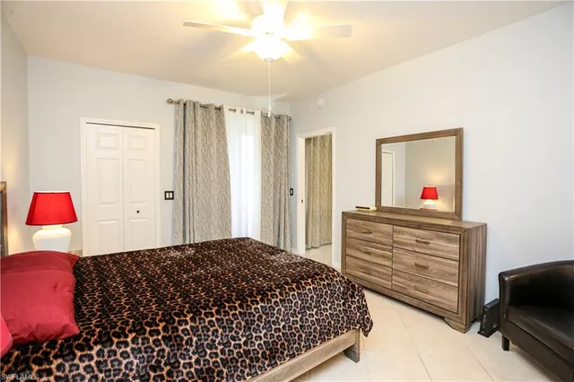 a bedroom with a bed and a dresser