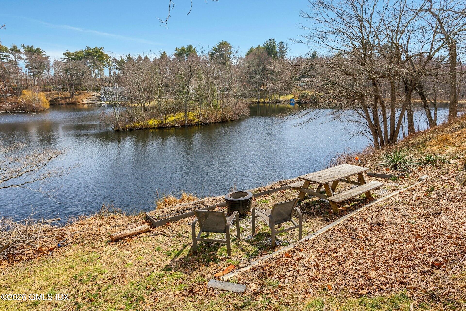83 Burning Tree Road Greenwich, CT 06830 - Photo 21 of 26 a view of a lake with houses