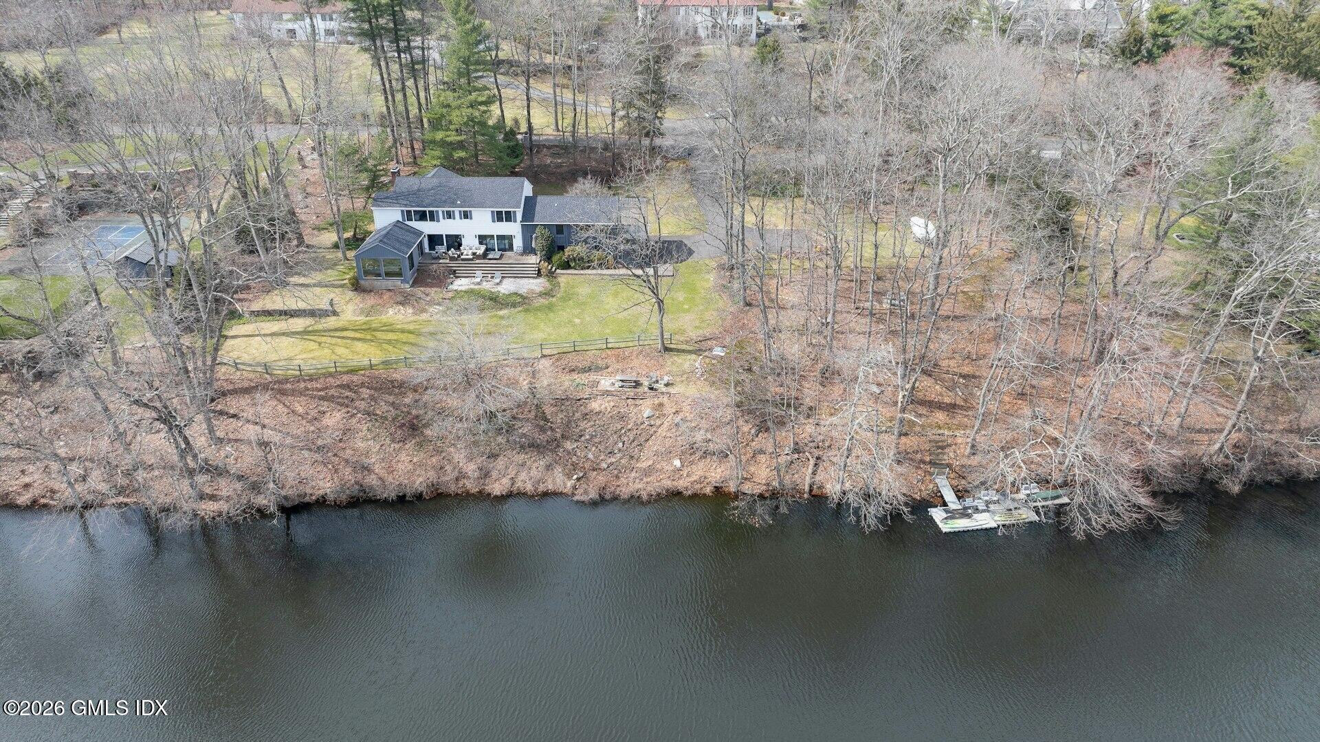 83 Burning Tree Road Greenwich, CT 06830 - Photo 24 of 26 a view of a lake with houses
