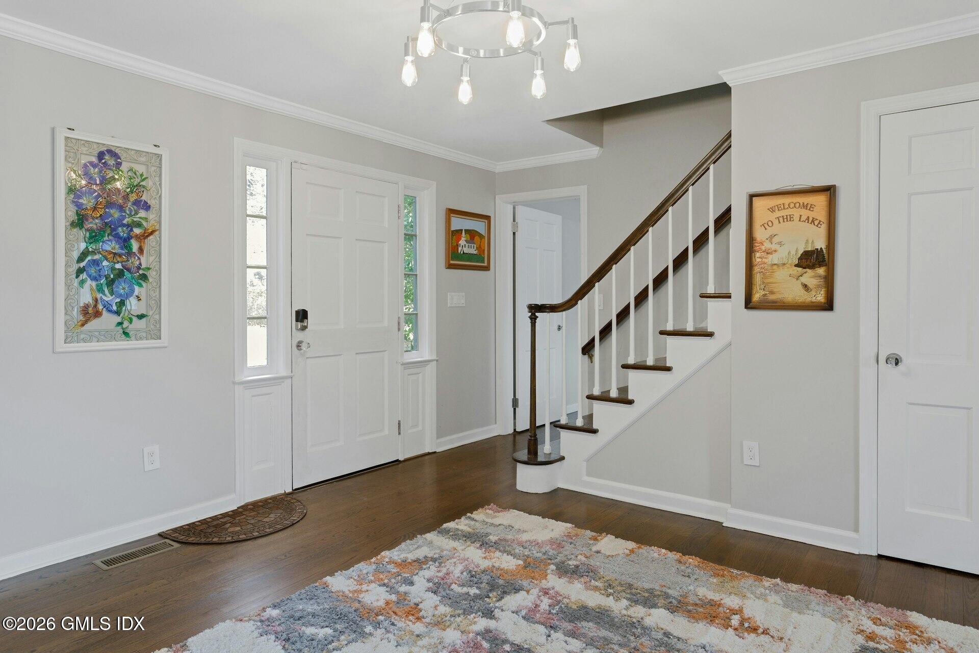 83 Burning Tree Road Greenwich, CT 06830 - Photo 3 of 26 a view of entryway with stairs and wooden floor