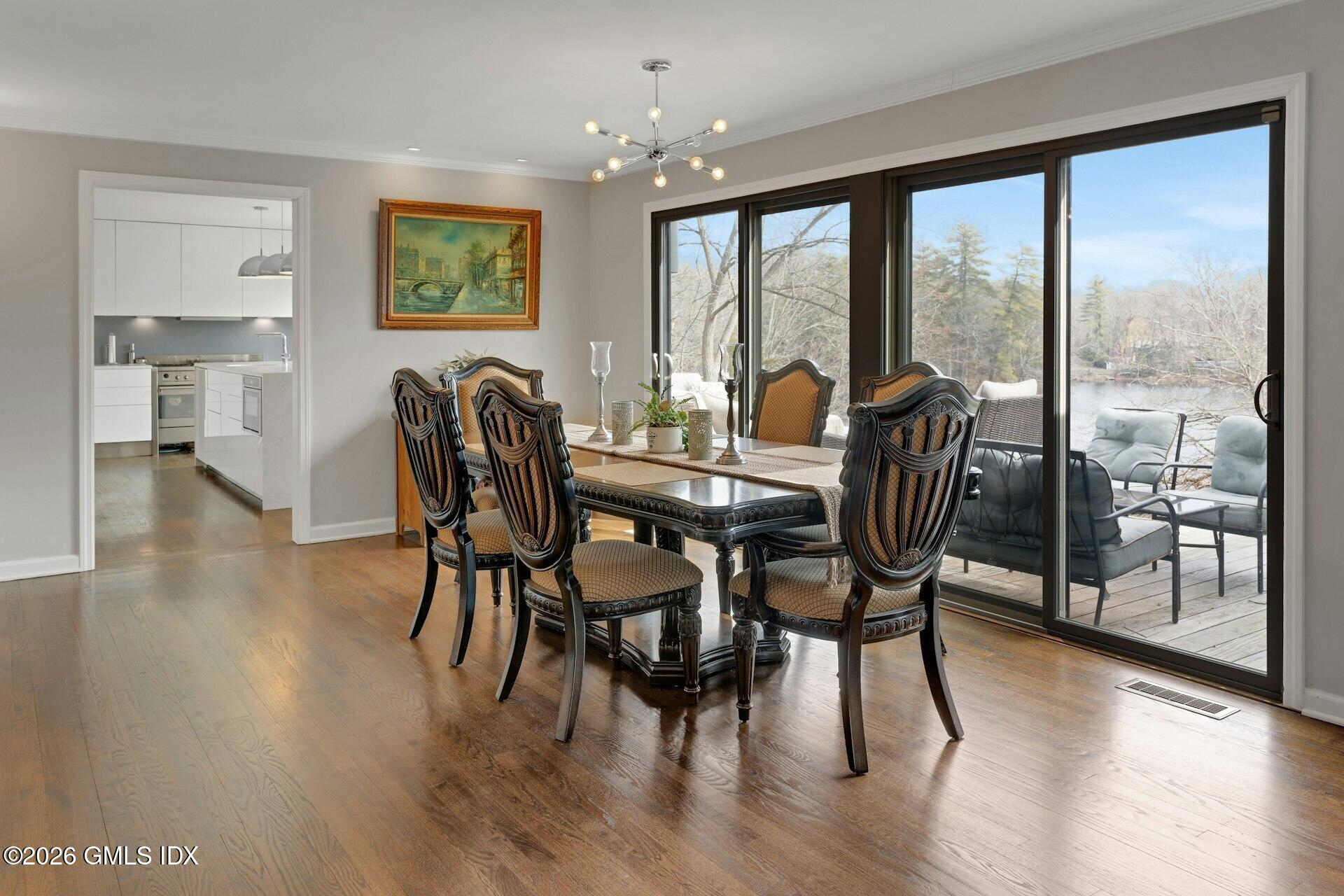 83 Burning Tree Road Greenwich, CT 06830 - Photo 8 of 26 a view of a dining room with furniture window and wooden floor