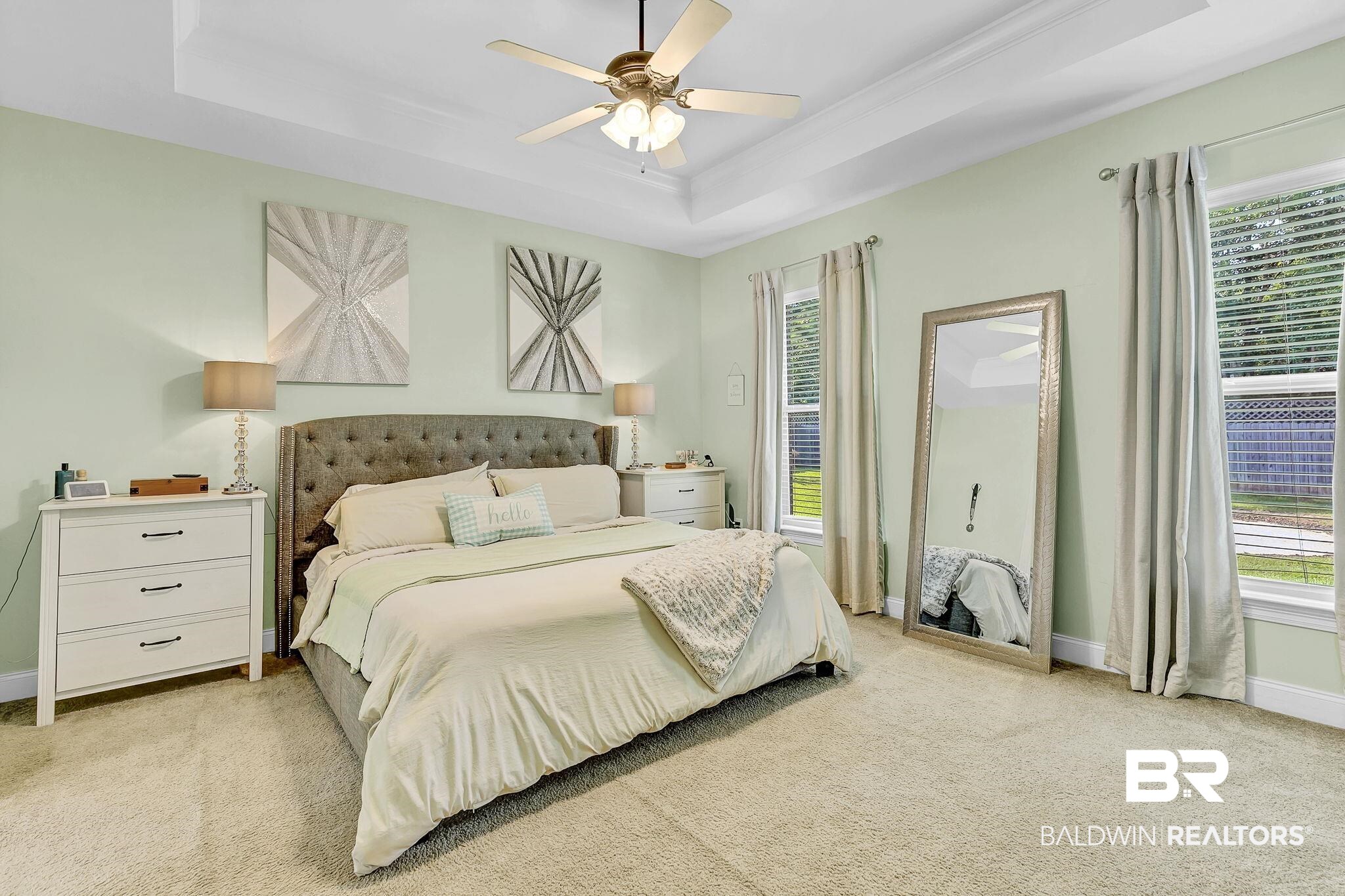 30635 Drayton Court Daphne, AL 36527 - Photo 20 of 51 Bedroom featuring a tray ceiling, light colored carpet, baseboards, a ceiling fan, and crown molding