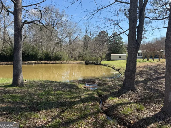 a view of a lake with a yard