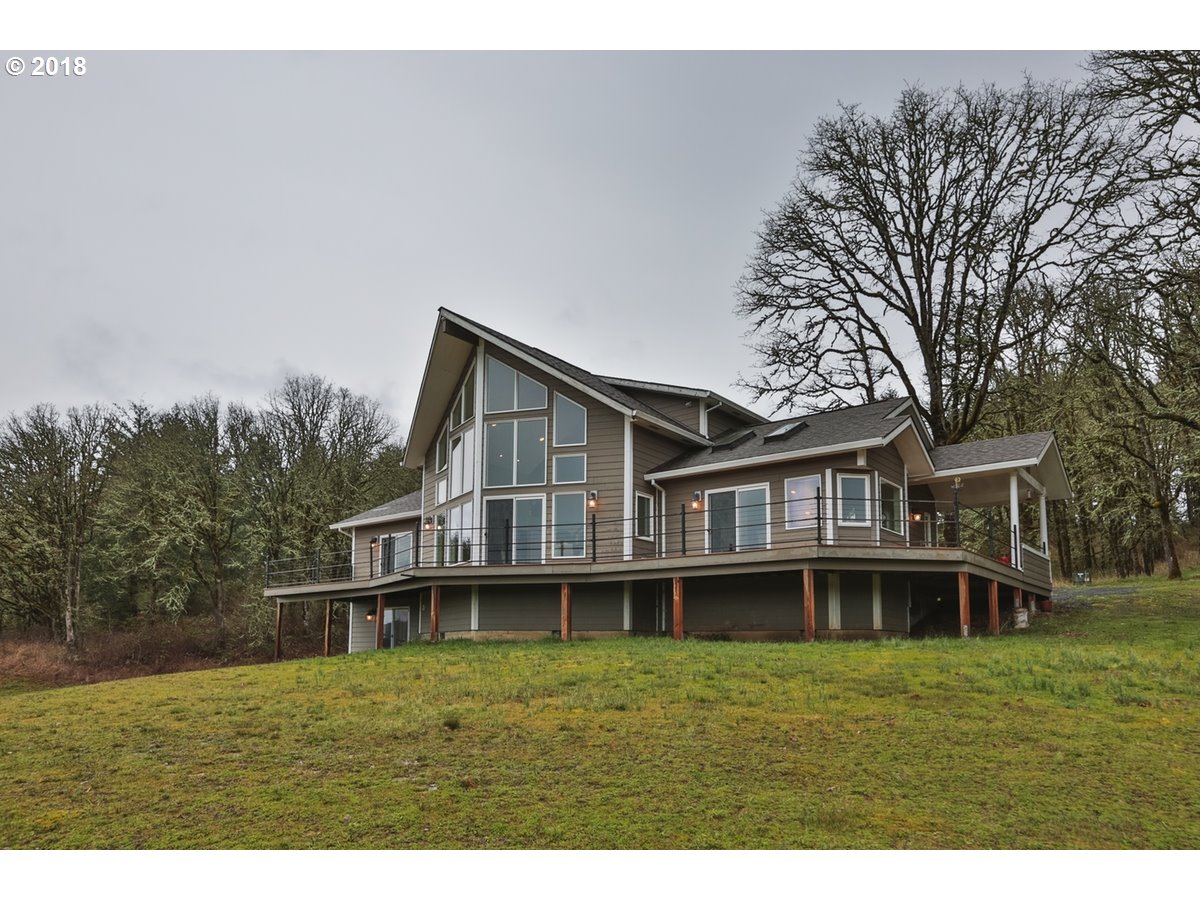 13205 Southwest Spring Hill Road Gaston, OR 97119 - Photo 1 of 30 a front view of a house with a yard