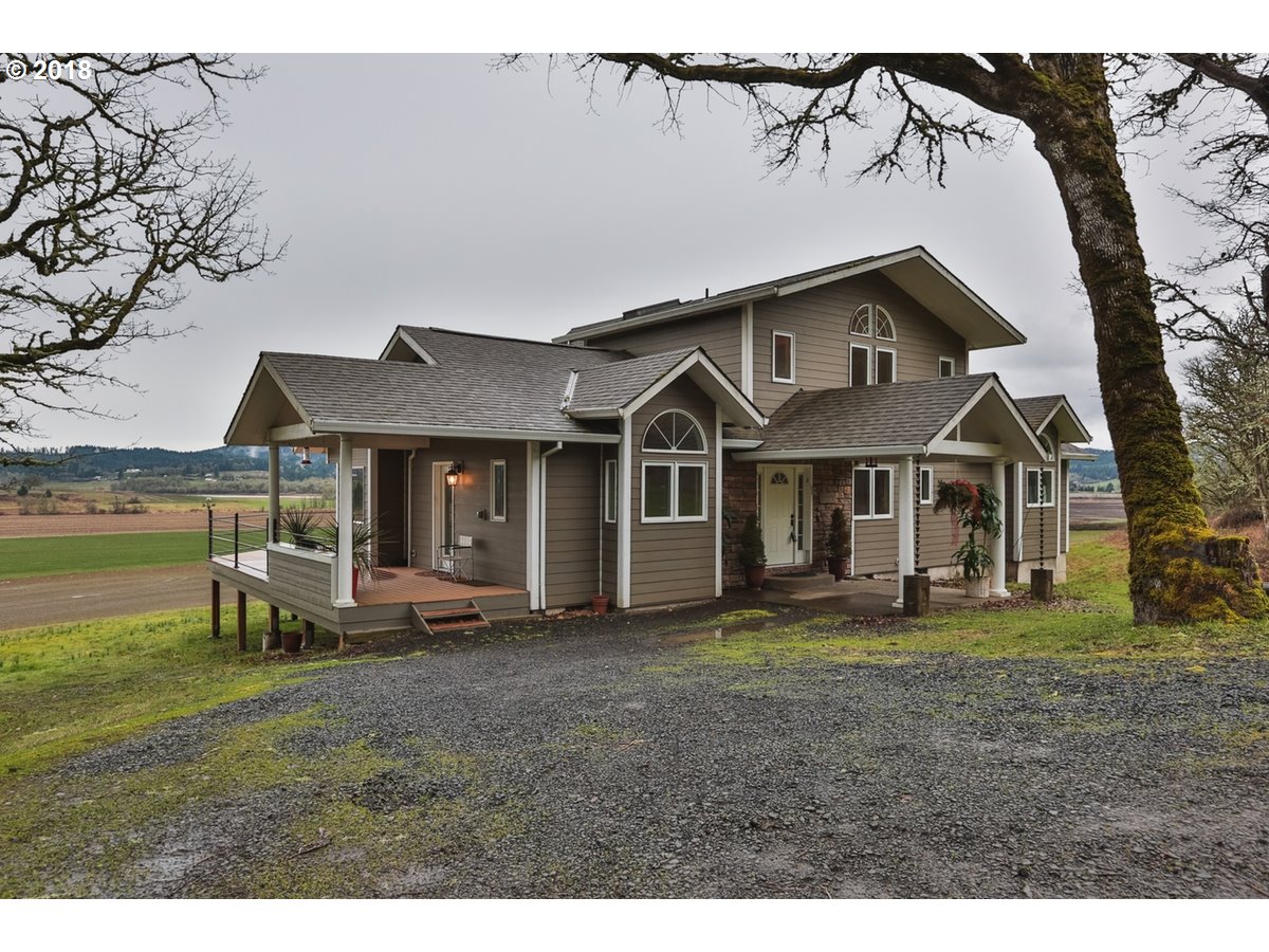 13205 Southwest Spring Hill Road Gaston, OR 97119 - Photo 2 of 30 a front view of a house with garden