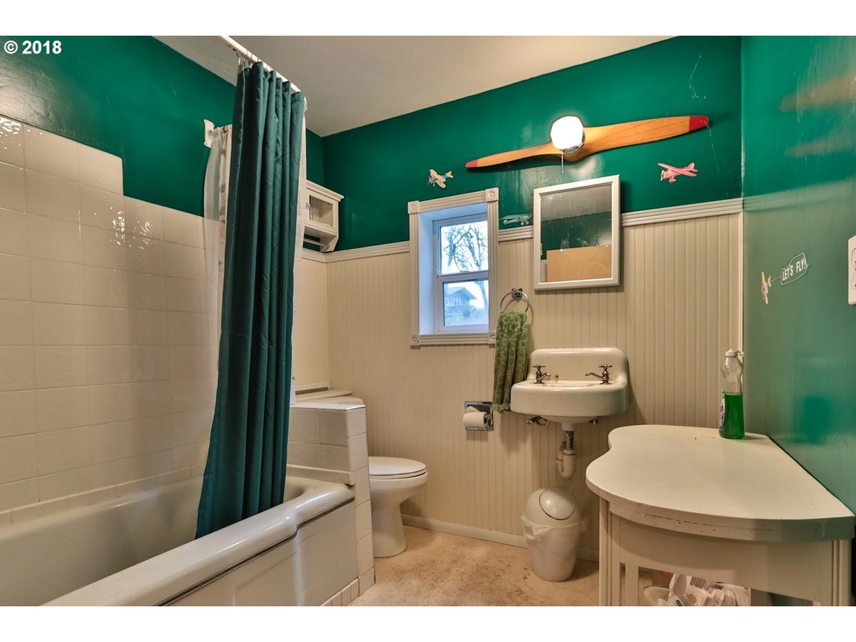 13205 Southwest Spring Hill Road Gaston, OR 97119 - Photo 24 of 30 a bathroom with a toilet and a sink