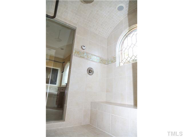 1816 Torrington Street Raleigh, NC 27615 - Photo 14 of 25 a bathroom with a shower and a mirror