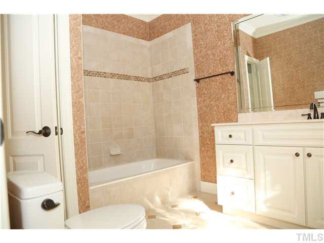 1816 Torrington Street Raleigh, NC 27615 - Photo 17 of 25 a bathroom with a bathtub and a shower