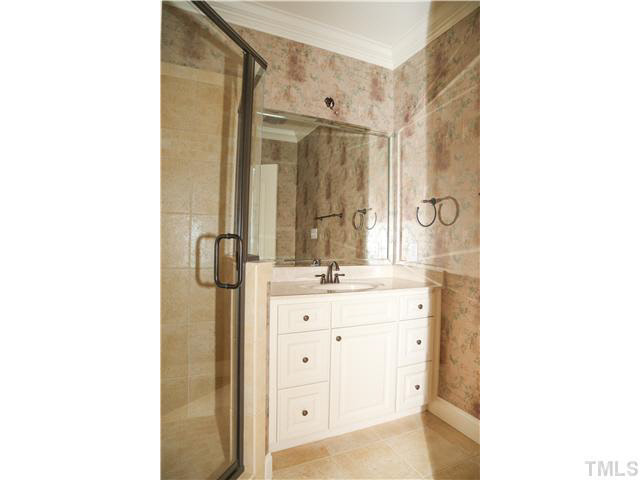 1816 Torrington Street Raleigh, NC 27615 - Photo 21 of 25 a bathroom with a granite countertop sink mirror and double