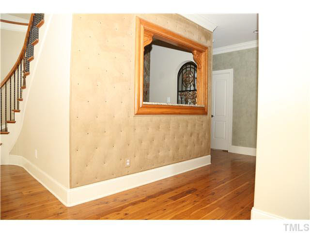 1816 Torrington Street Raleigh, NC 27615 - Photo 4 of 25 a view of a hallway with wooden floor