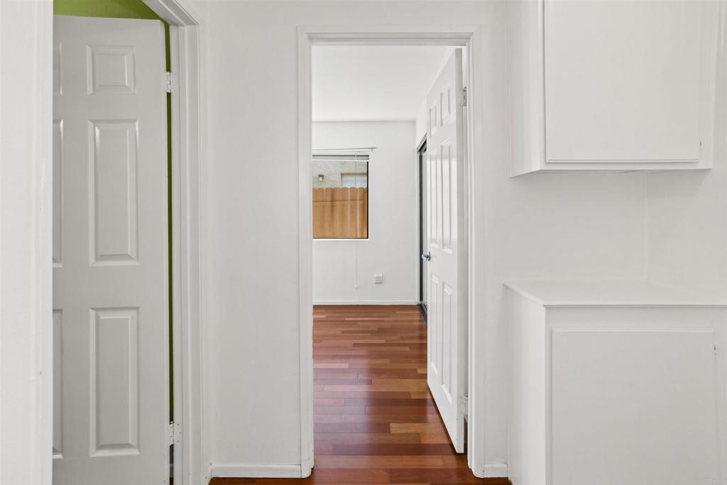 1387 Longfellow Road Vista, CA 92081 - Photo 18 of 38 a view of a hallway with wooden floor