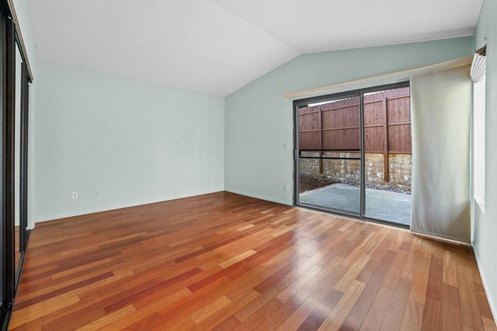 1387 Longfellow Road Vista, CA 92081 - Photo 20 of 38 a view of empty room with wooden floor and fan