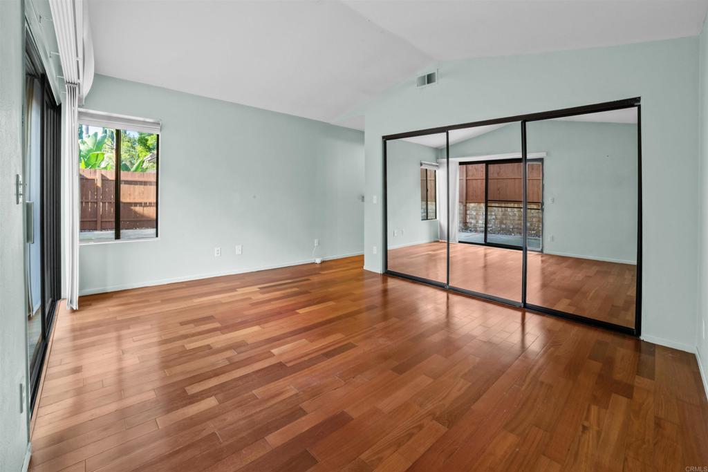 1387 Longfellow Road Vista, CA 92081 - Photo 21 of 38 a view of empty room with wooden floor and fan