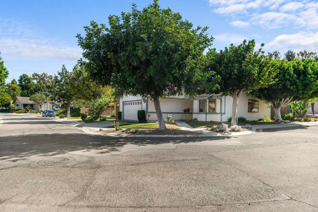 1387 Longfellow Road Vista, CA 92081 - Photo 3 of 38 a view of a house with a yard and large trees
