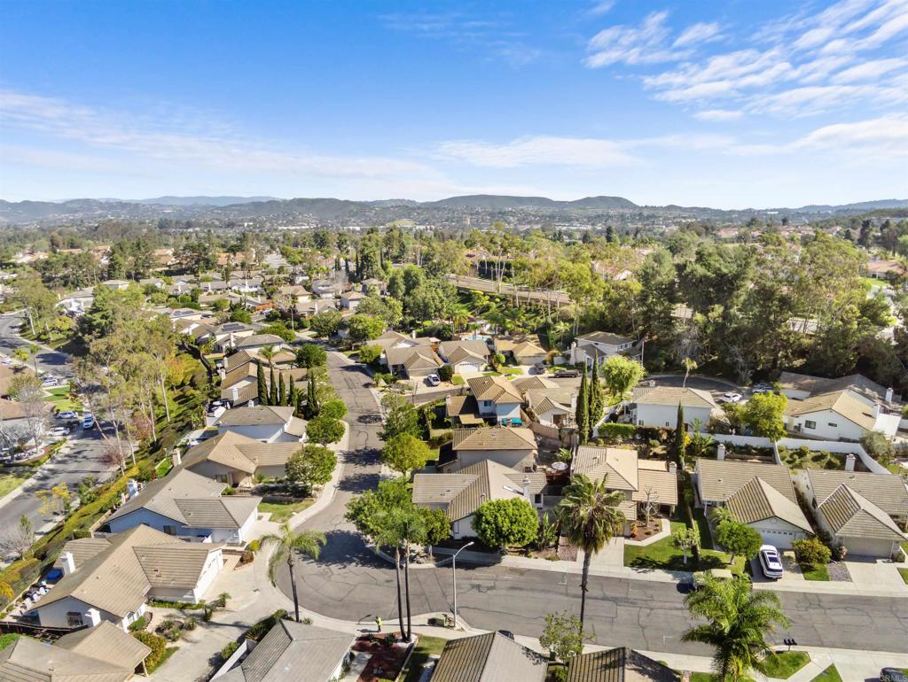 1387 Longfellow Road Vista, CA 92081 - Photo 33 of 38 an aerial view of a city with lots of residential buildings