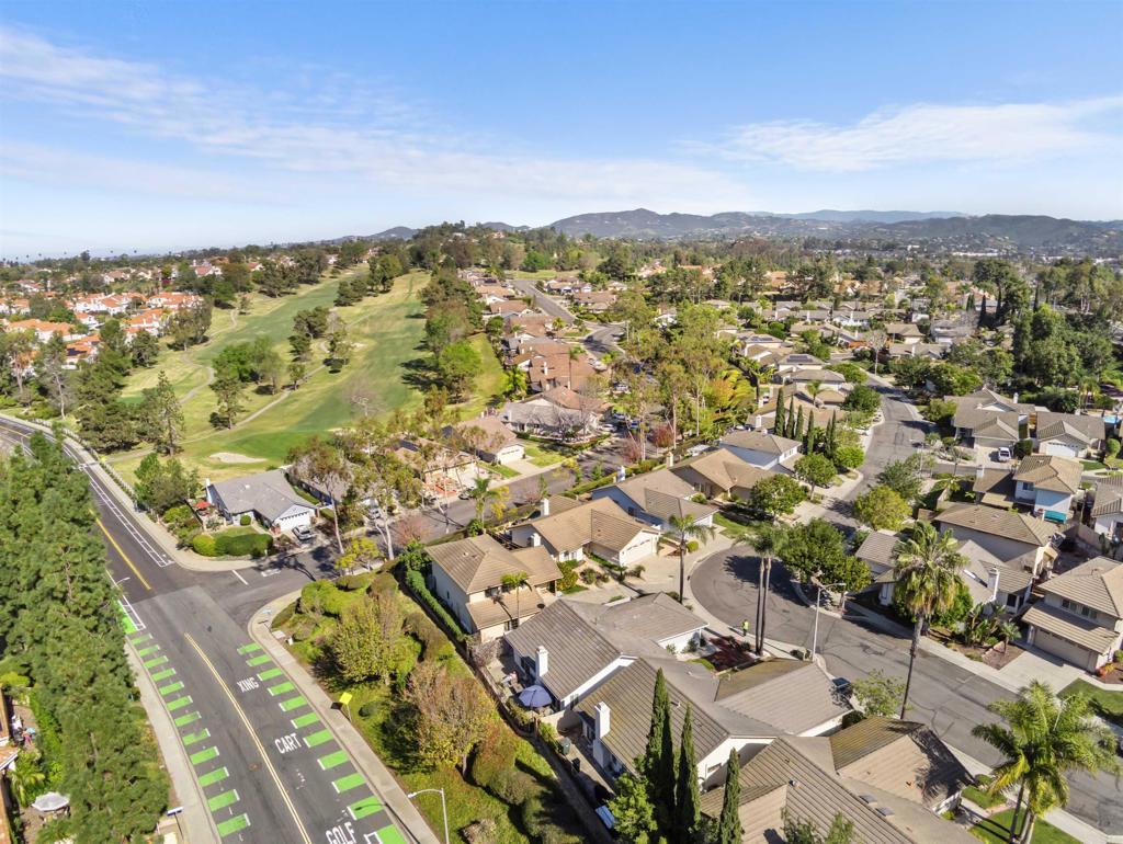 1387 Longfellow Road Vista, CA 92081 - Photo 35 of 38 an aerial view of residential building with parking space