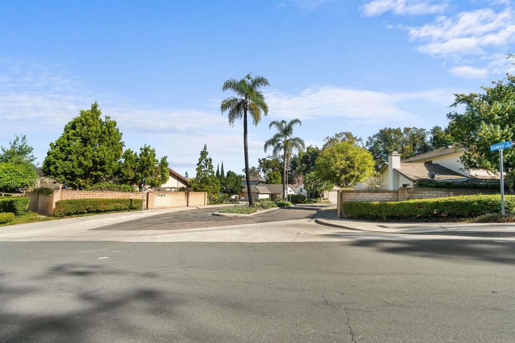 1387 Longfellow Road Vista, CA 92081 - Photo 38 of 38 a view of a street with a cars parked in front of it