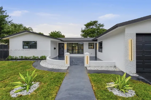 a front view of house with yard and green space