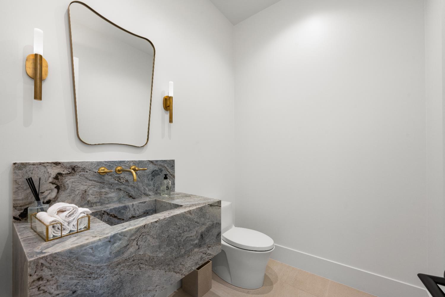 2735 Rattlesnake Road Newcastle, CA 95658 - Photo 21 of 84 a bathroom with a sink and mirror with toilet