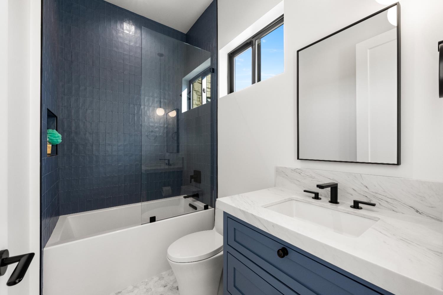 2735 Rattlesnake Road Newcastle, CA 95658 - Photo 27 of 84 a bathroom with a granite countertop sink a toilet a mirror and bathtub
