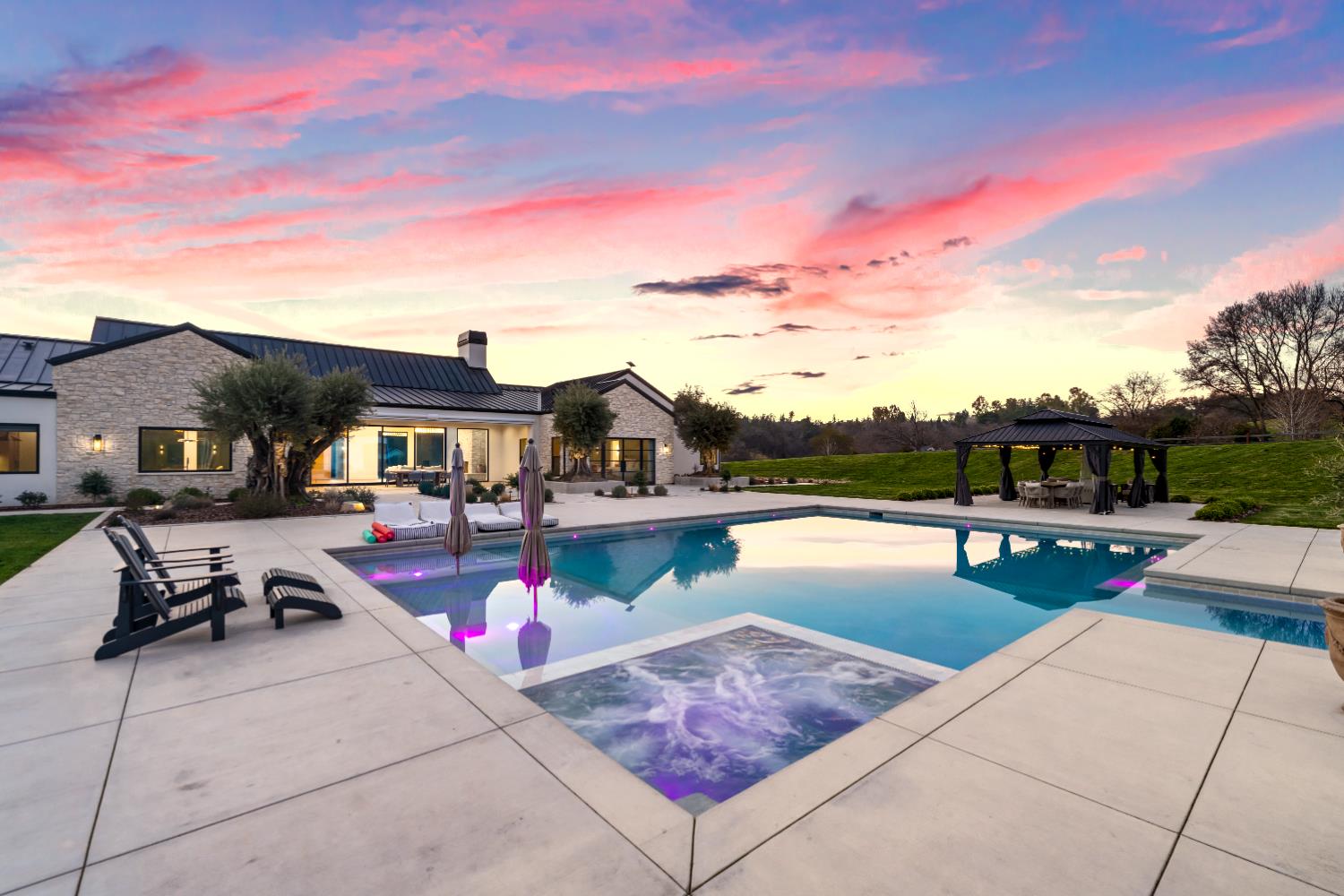 2735 Rattlesnake Road Newcastle, CA 95658 - Photo 56 of 84 a view of a swimming pool with a lounge chair and a fire pit