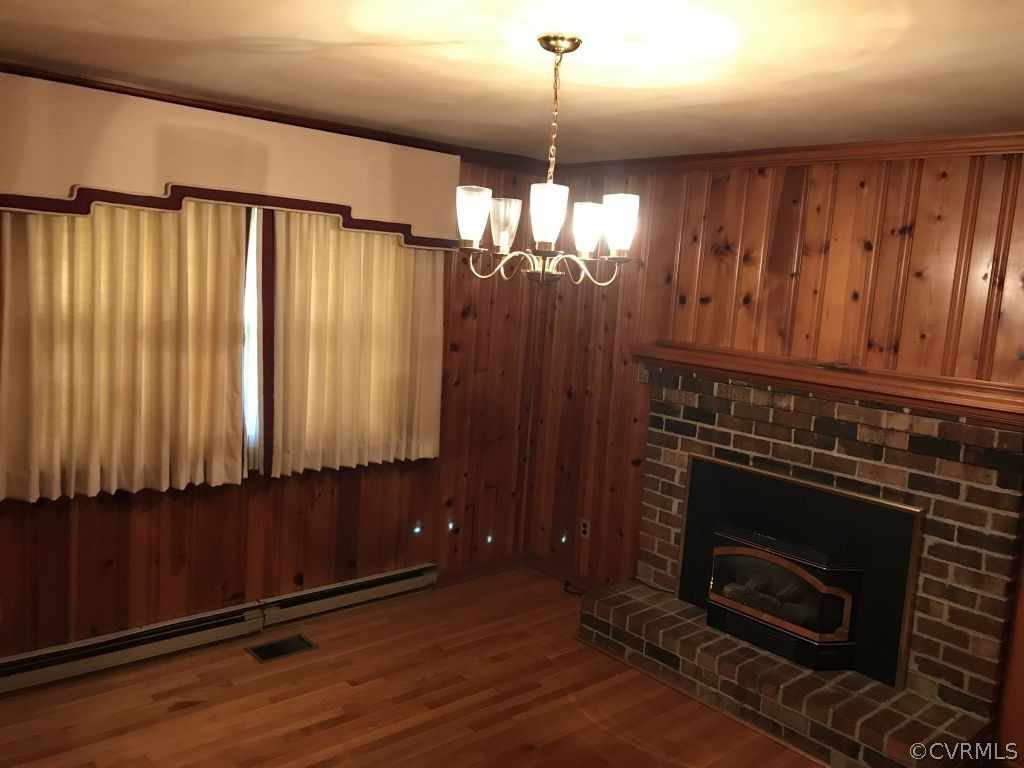 2800 Quaker Road Quinton, VA 23141 - Photo 7 of 8 a view of a livingroom with a fireplace window and wooden floor
